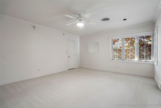 unfurnished room with visible vents, crown molding, light colored carpet, and a ceiling fan