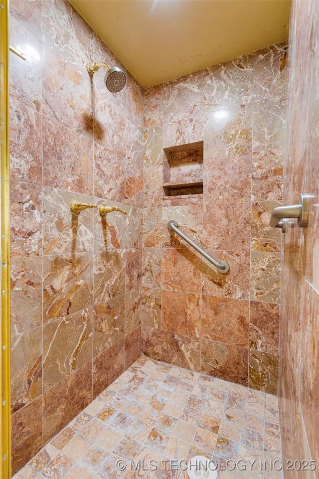 bathroom featuring tiled shower