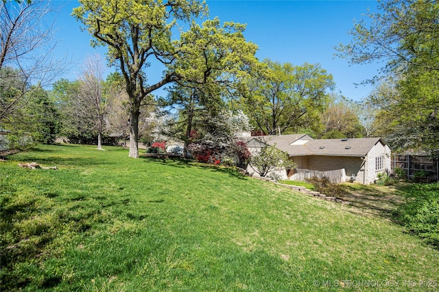view of yard featuring fence