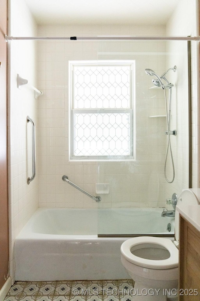 bathroom featuring toilet, tile patterned floors, shower / tub combination, and vanity