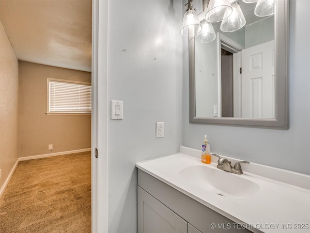 bathroom with vanity and baseboards
