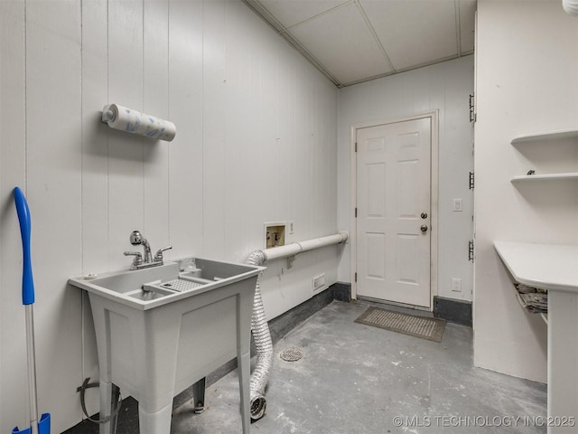 laundry area with laundry area, a sink, and hookup for a washing machine