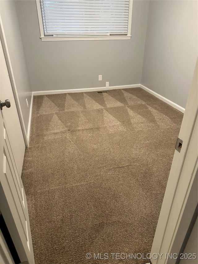 1558 E 59th Pl, Tulsa, OK 74105 - carpeted spare room featuring baseboards