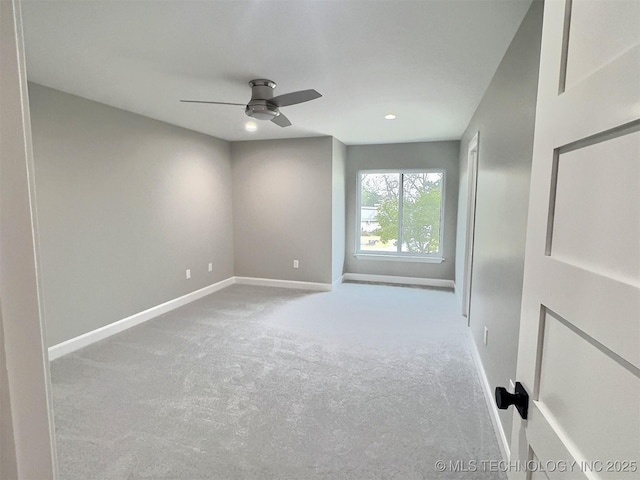 spare room featuring recessed lighting, baseboards, a ceiling fan, and carpet floors