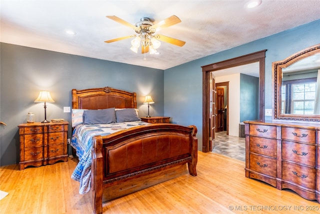 bedroom with ceiling fan, recessed lighting, and wood finished floors