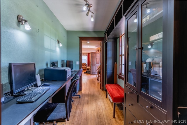 office space with light wood-style flooring