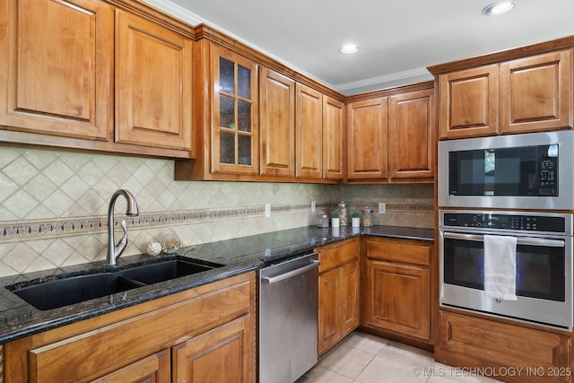 3531 E 100th St, Tulsa, OK 74137 - kitchen with brown cabinets, stainless steel appliances, and a sink