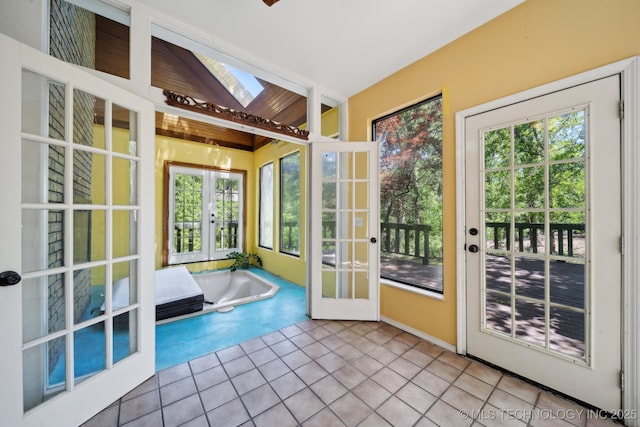 3531 E 100th St, Tulsa, OK 74137 - entryway featuring a healthy amount of sunlight, french doors, tile patterned floors, and a skylight
