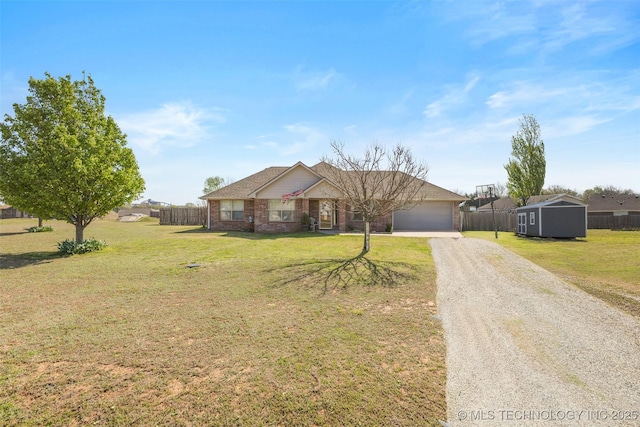 single story home with an attached garage, fence, brick siding, a front lawn, and driveway