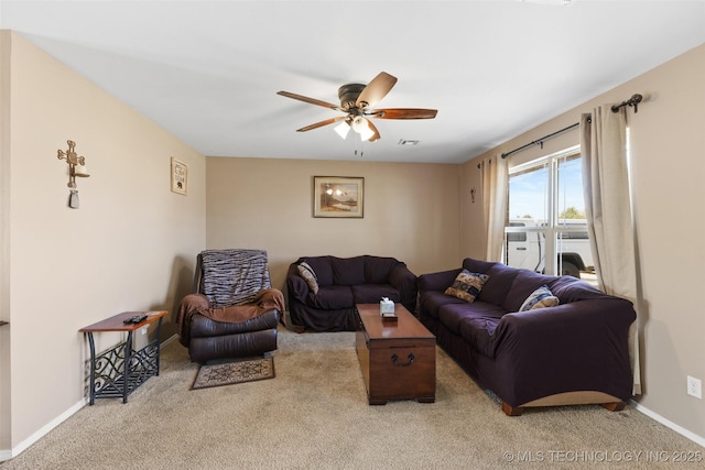 carpeted living room featuring visible vents, baseboards, and ceiling fan