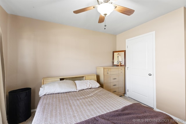 bedroom with light carpet, baseboards, and a ceiling fan