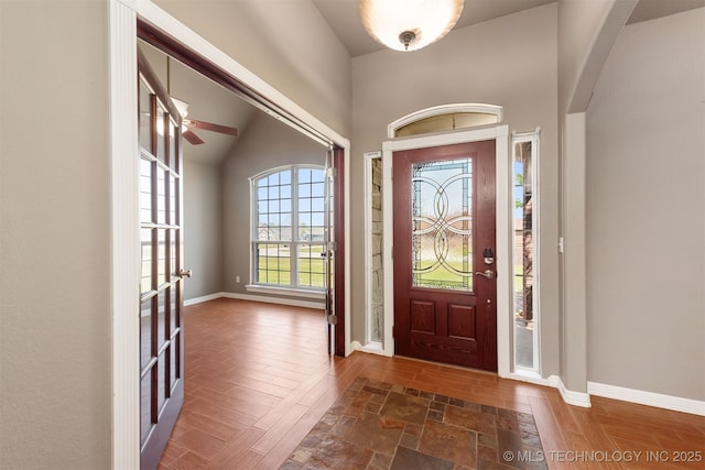 705 SW 20th St, Wagoner, OK 74467 - entrance foyer featuring arched walkways, wood finished floors, ceiling fan, and baseboards