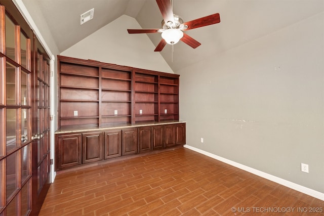 705 SW 20th St, Wagoner, OK 74467 - empty room with high vaulted ceiling, ceiling fan, visible vents, light wood finished floors, and baseboards