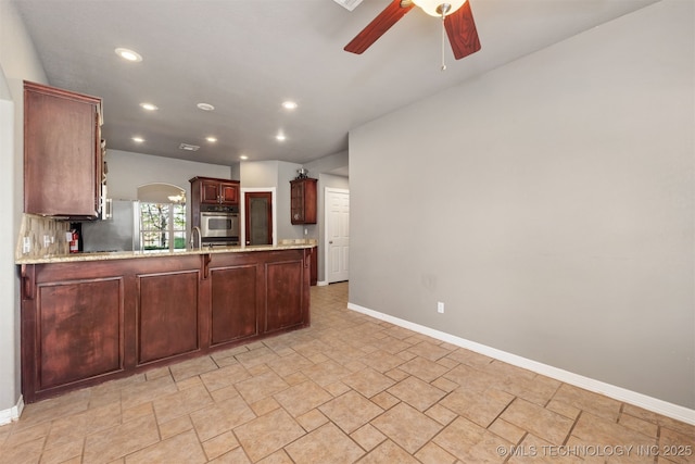 705 SW 20th St, Wagoner, OK 74467 - kitchen with appliances with stainless steel finishes, baseboards, a ceiling fan, and recessed lighting