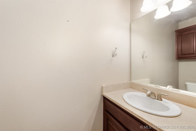 705 SW 20th St, Wagoner, OK 74467 - half bathroom featuring toilet and vanity