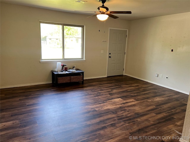 28494 E 139th St S, Coweta, OK 74429 - empty room featuring dark wood finished floors, baseboards, a ceiling fan, and visible vents