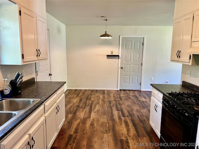 28494 E 139th St S, Coweta, OK 74429 - kitchen with white cabinetry, dark countertops, black gas range oven, visible vents, and a sink