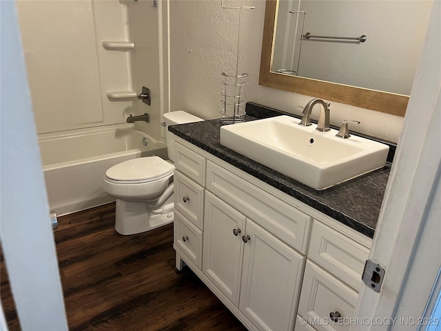 28494 E 139th St S, Coweta, OK 74429 - bathroom with toilet, wood finished floors, vanity, and a textured wall