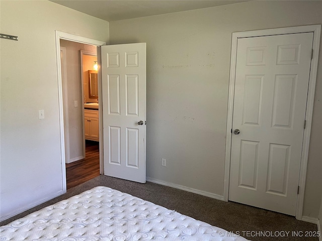28494 E 139th St S, Coweta, OK 74429 - unfurnished bedroom with baseboards and dark carpet