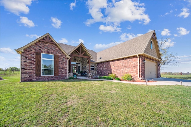 369102 E 960 Road, Road, OK 74833 - view of front facade featuring a front yard, roof with shingles, brick siding, and concrete driveway