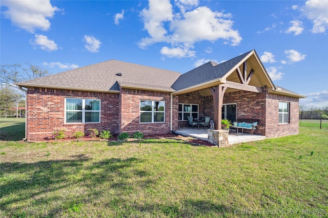 369102 E 960 Road, Road, OK 74833 - back of property with a yard, brick siding, a patio, and roof with shingles