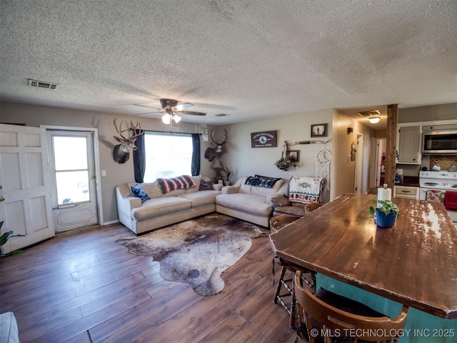 22526 N 2860th Rd, Kingfisher, OK 73750 - living area with a textured ceiling, a ceiling fan, and visible vents