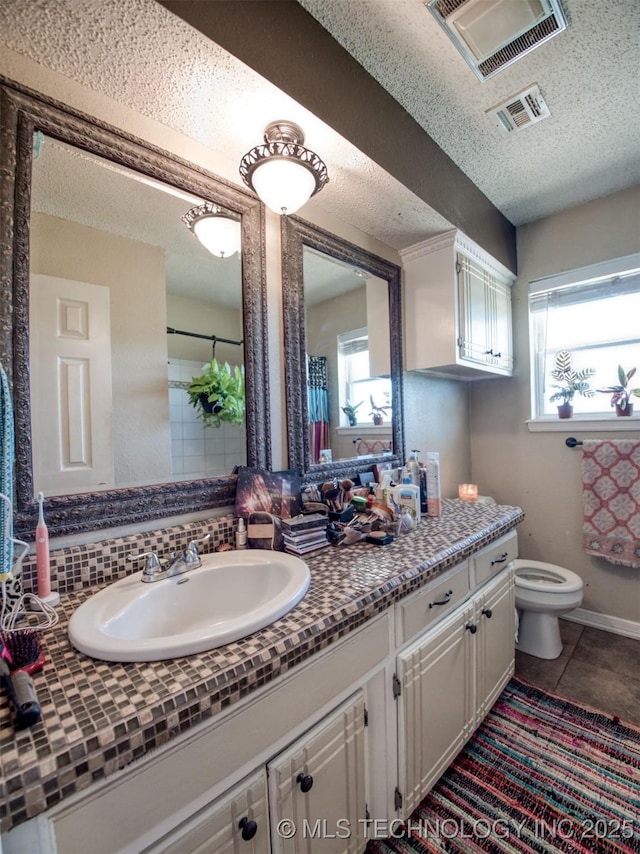 22526 N 2860th Rd, Kingfisher, OK 73750 - bathroom featuring vanity, tile patterned floors, a textured ceiling, toilet, and visible vents