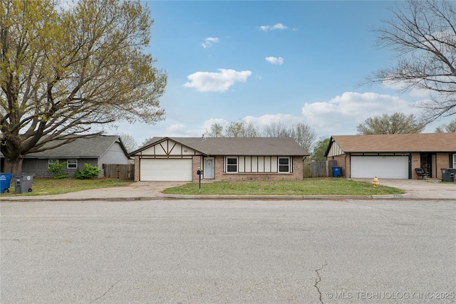 6429 S 30th W Ave, Tulsa, OK 74132 - view of front of home featuring brick siding, driveway, and a garage