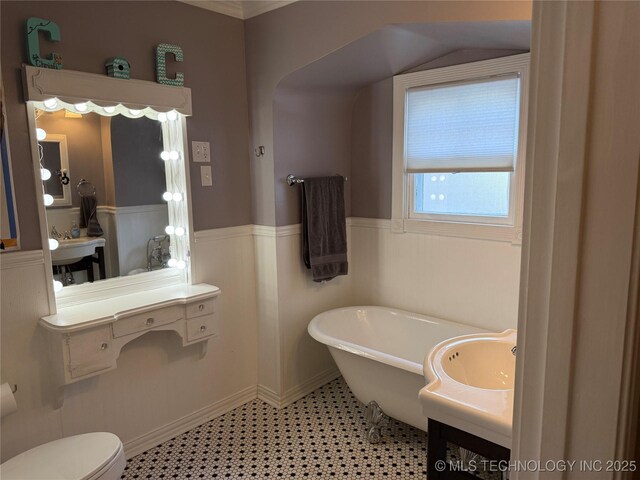 1400 Hillcrest, Bartlesville, OK 74003 - bathroom with a freestanding bath, toilet, wainscoting, and vanity