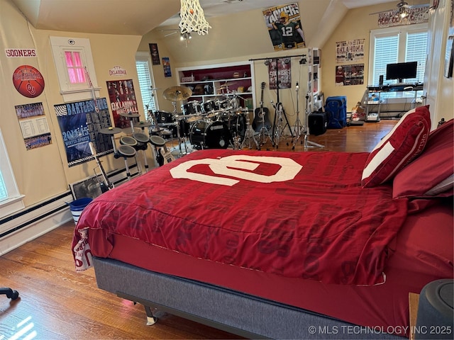 1400 Hillcrest, Bartlesville, OK 74003 - bedroom featuring wood finished floors, multiple windows, and a chandelier