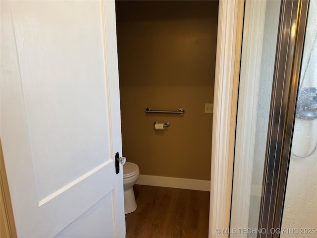1400 Hillcrest, Bartlesville, OK 74003 - bathroom featuring wood finished floors, toilet, and baseboards
