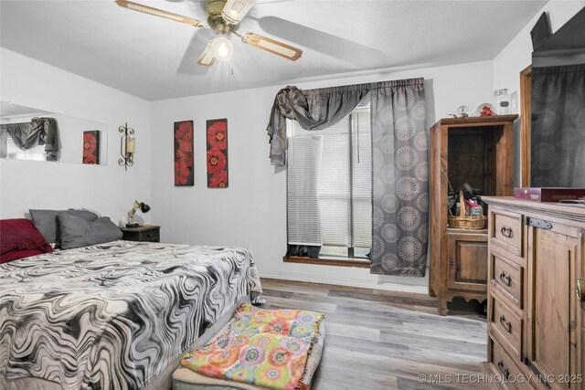 6370 S 29th W Pl, Tulsa, OK 74132 - bedroom featuring wood finished floors, ceiling fan, and baseboards
