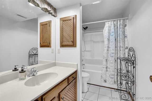 6370 S 29th W Pl, Tulsa, OK 74132 - bathroom featuring vanity, toilet, tile patterned flooring, and shower / tub combo with curtain