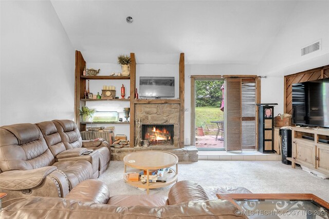 6370 S 29th W Pl, Tulsa, OK 74132 - living area with carpet floors, vaulted ceiling, and a stone fireplace
