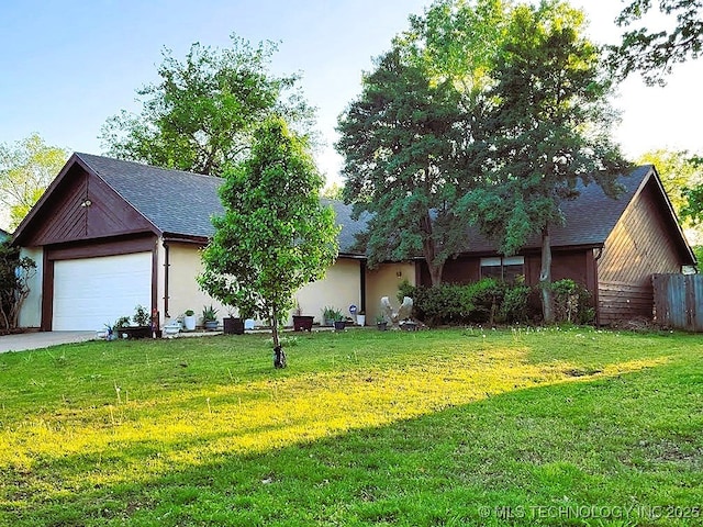 6370 S 29th W Pl, Tulsa, OK 74132 - view of front of home with roof with shingles, concrete driveway, stucco siding, and a garage