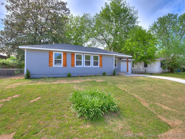 4916 S Cincinnati Ave, Tulsa, OK 74105 - ranch-style home featuring a front lawn, concrete driveway, and fence