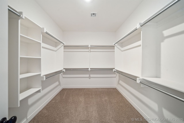 walk in closet with carpet flooring and visible vents