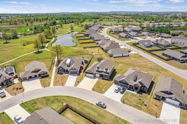 aerial view featuring a residential view and a water view