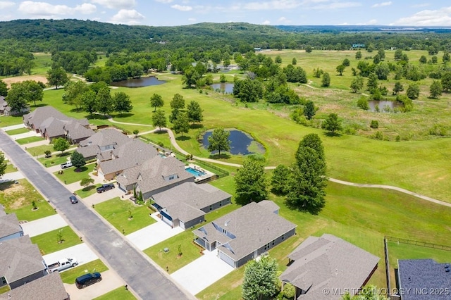 bird's eye view featuring a residential view and a water view
