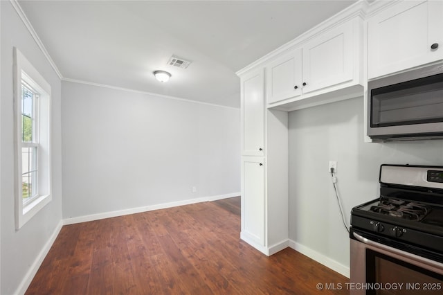 920 E 33rd St N, Tulsa, OK 74106 - kitchen featuring stainless steel appliances, dark wood finished floors, white cabinets, baseboards, and crown molding