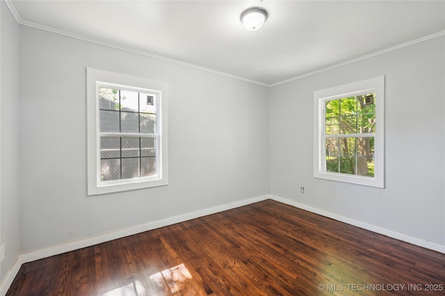 920 E 33rd St N, Tulsa, OK 74106 - empty room with healthy amount of natural light, ornamental molding, dark wood-style flooring, and baseboards