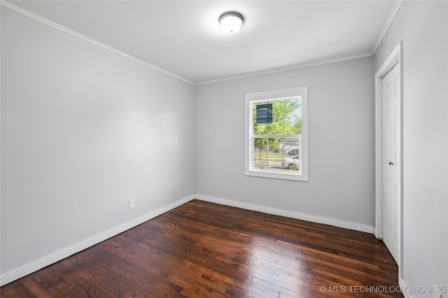 920 E 33rd St N, Tulsa, OK 74106 - unfurnished bedroom featuring crown molding, wood finished floors, and baseboards