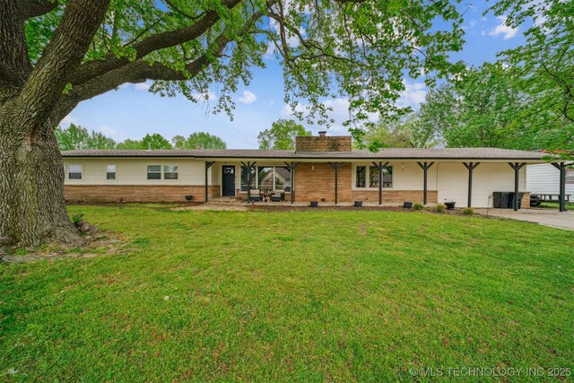 single story home with a chimney and a front yard