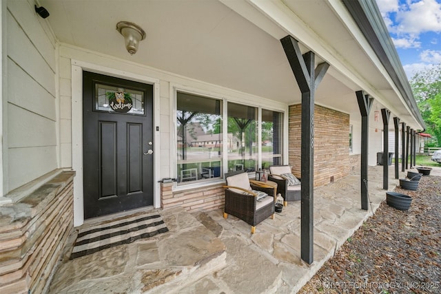 entrance to property featuring covered porch
