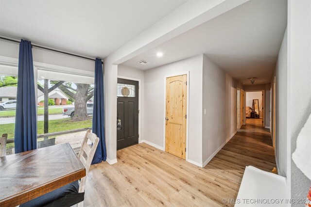 entrance foyer with light wood-type flooring, baseboards, recessed lighting, and visible vents