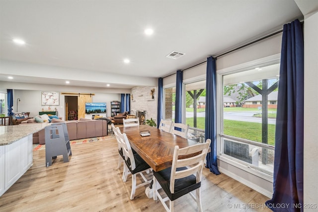 dining area featuring visible vents, light wood finished floors, and recessed lighting