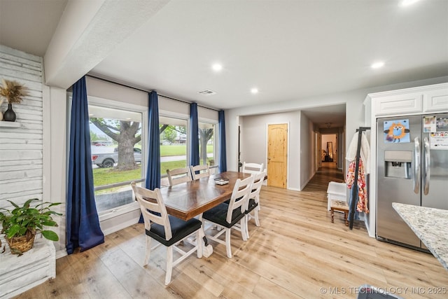 dining space with recessed lighting, light wood-style floors, and visible vents
