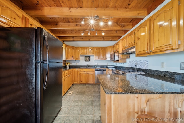 14484 Valley View Dr, Skiatook, OK 74070 - kitchen with freestanding refrigerator, under cabinet range hood, stainless steel dishwasher, a wooden ceiling with exposed beams, and a peninsula