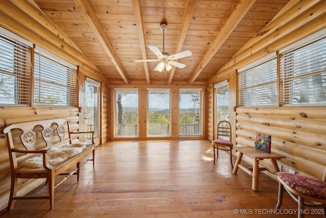 14484 Valley View Dr, Skiatook, OK 74070 - living area with a wooden ceiling with exposed beams, rustic walls, light wood finished floors, and a ceiling fan