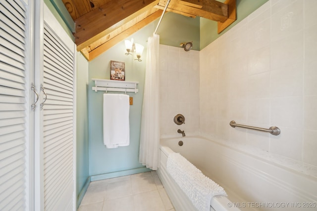 full bath featuring shower / tub combo and tile patterned flooring